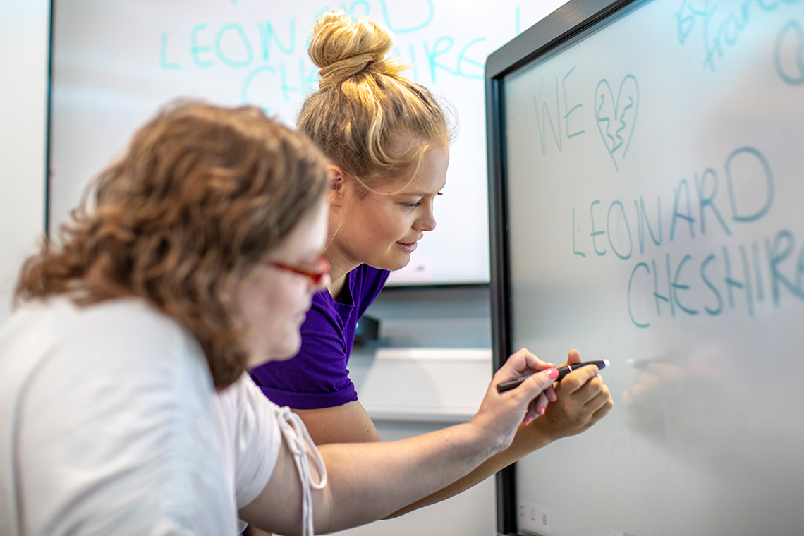 Resident and helper using interactive screen